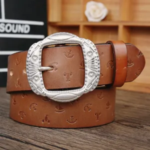 Vintage brown leather belt featuring decorative metal buckle and embossed pattern.