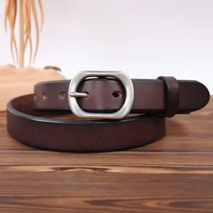 Detailed view of genuine leather belt showing fine texture and sturdy silver metal pin buckle.