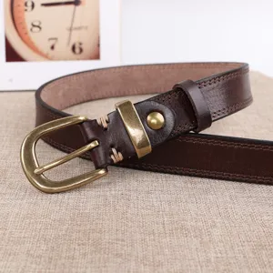 Genuine leather women's belt detail view, vintage brass pin buckle, brown cowhide design.