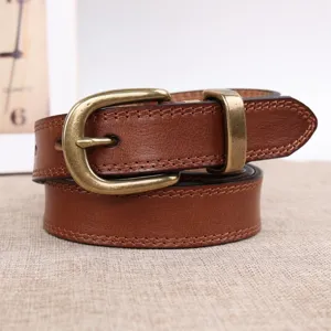 Vintage genuine leather belt detail shot, showing brass pin buckle, double stitching and texture.