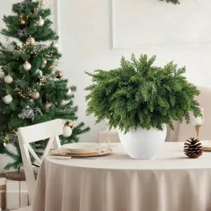 Lush artificial Norfolk pine bundle in a white vase for festive Christmas table decor.