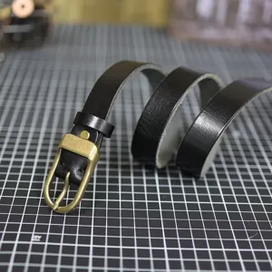 Black genuine leather thin belt for women with vintage brass buckle, stylish narrow strap.
