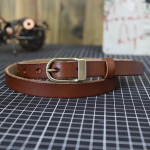 Brown genuine leather thin belt for women with retro metal buckle, stylish narrow waist strap.