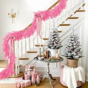 Pink Norfolk pine garland draped on a white staircase for festive home decoration.
