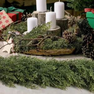 Close-up of lifelike Norfolk pine garland for festive Christmas table and mantle decor