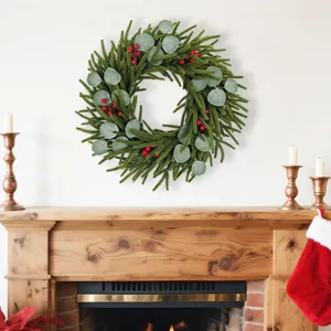 Visual of a Christmas wreath with berries and eucalyptus displayed in a cozy home fireplace setting
