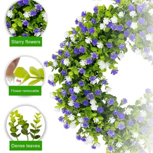 Detail views of spring eucalyptus wreath with removable purple and white flowers.