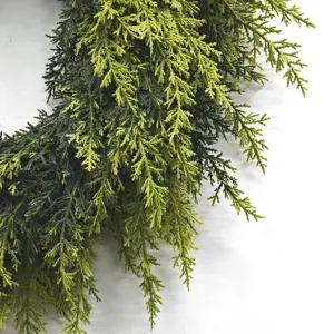 High-quality close-up detail showing realistic green cedar branches for Christmas wreath decor