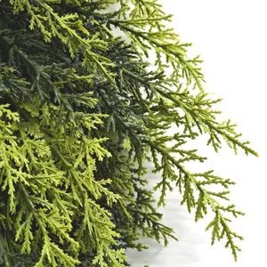 Macro detail of realistic soft-touch artificial cedar foliage for Christmas decor