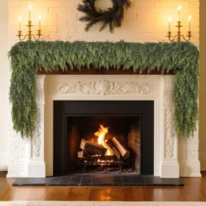 Artificial Norfolk Pine garland draped over a cozy fireplace mantel decoration