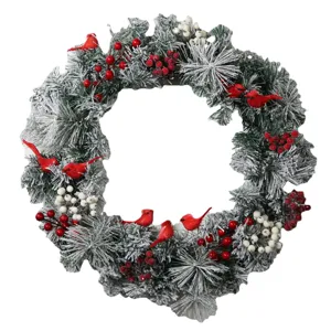 Detailed view of a flocked Christmas wreath featuring cardinal birds and red berries.
