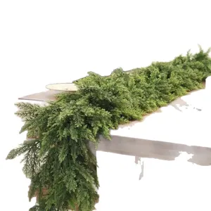 Long green Norfolk pine artificial garland for Christmas table or door decoration