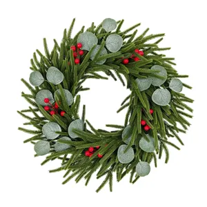 Realistic Christmas wreath with cedar, eucalyptus leaves and red berries for door