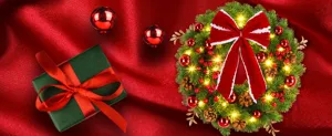 Detailed close-up of a lit Christmas wreath with a large red bow on red satin fabric