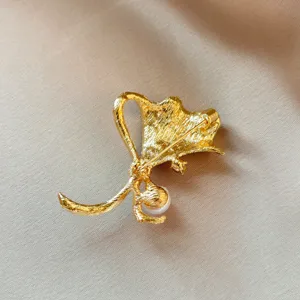 Gold ginkgo leaf brooch pin with pearl accent elegant fashion jewelry accessory for women