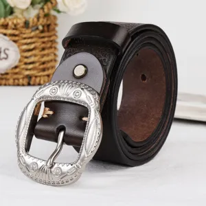 Retro western style women leather belt with ornate silver metal buckle for jeans and daily wear.