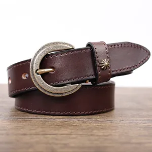 Close-up view of vintage genuine leather belt showcasing metal buckle and texture.