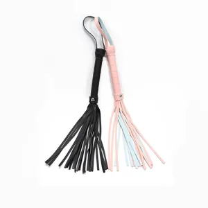 PU leather fringe whip costume accessory detail shot, black and pink multi-strand design.