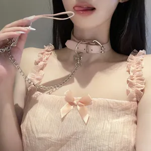 Pink leather choker collar detail with metal chain and cute bone pendant for trendy looks.
