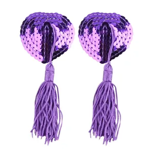 Purple sequin heart tassel pasties detail close up, intimate costume accessory sparkling design.