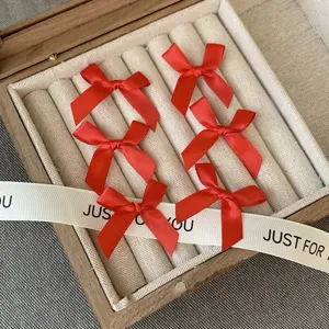 Red ribbon bow hair clips set, exquisite satin material, perfect for daily wear and styling.
