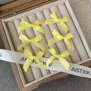 Yellow satin ribbon hair bows set, cute mini hair clips and accessories for women and girls.