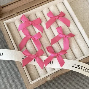 Pink ribbon bow hair clip, cute balletcore hair accessory for women and girls daily styling.