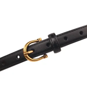 Classic women black leather belt featuring a sleek gold horseshoe buckle, perfect for jeans.