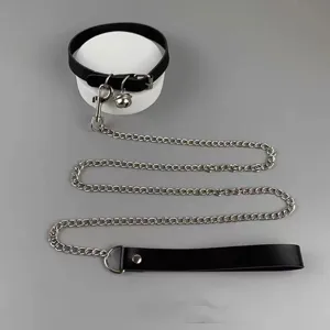 Detailed view of punk style black PU leather choker collar with metal bell and long chain leash.