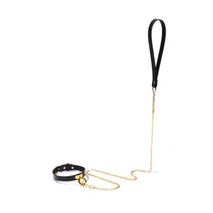 Fashion black leather choker necklace with gold metal chain and ring for women edgy style.