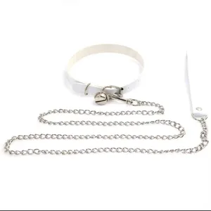 Detail view of white PU leather punk harajuku choker collar with bell and metal chain.