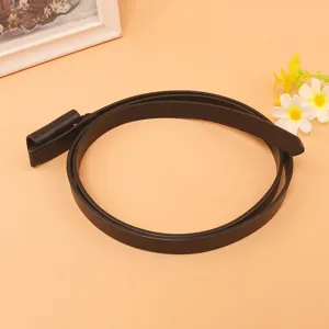 Detail view of a sleek black thin genuine leather belt for women's summer dresses
