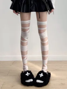 Detail shot of white bandage over-the-knee socks, unique Y2K subculture leg wear style.
