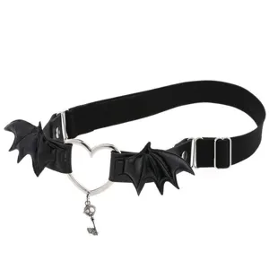 Gothic punk black leg garter detail, bat wings design, heart metal ring, skull key charm.