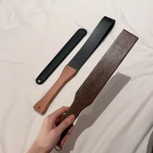 Adult BDSM spanking paddle set, wooden and leather flogger tools for daily practice.