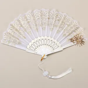 Close-up view of the exquisite white folding fan featuring delicate gold lace embroidery and pendant.