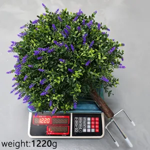 Artificial lavender bush garden stake being weighed on a digital scale, 1220g total