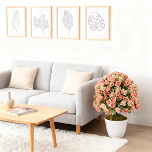 Large artificial rose bush in white pot styled in a modern minimalist living room setting