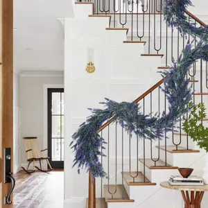 Artificial lavender garland draped elegantly on a white modern indoor staircase railing