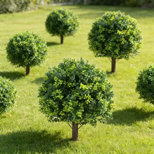 Lush green artificial boxwood topiary tree with realistic trunk for outdoor garden decor