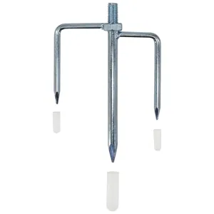 Detail view of durable silver three-tine metal ground spike with protective plastic caps.