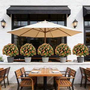Outdoor artificial potted daisy plants for garden cafe table decoration in a sunny patio