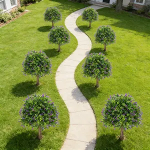 Artificial lavender topiary trees lining a winding stone path in a green garden