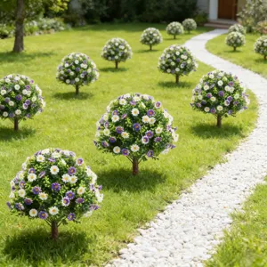 Artificial garden topiary trees with purple and white flowers on a scenic lawn path