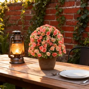 Detailed view of artificial pink rose potted plant on a rustic wooden outdoor table