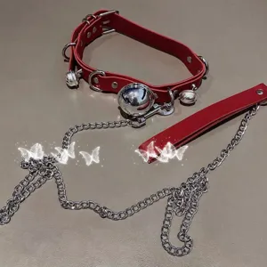 Red leather collar with silver bells and chain leash set for gothic fashion and alternative style.