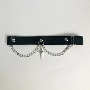 Details of the punk gothic star chain garter, showing the metal pendant and black strap clearly.