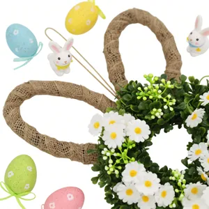 Detail van de Paashaaskrans met witte madeliefjes en groene bladeren voor decoratie