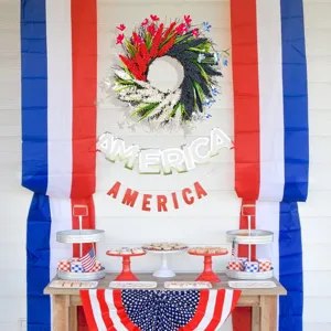 Red white and blue patriotic wreath displayed in a festive July 4th home setting