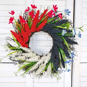 Detailed view of patriotic red white and blue floral wreath with green leaves